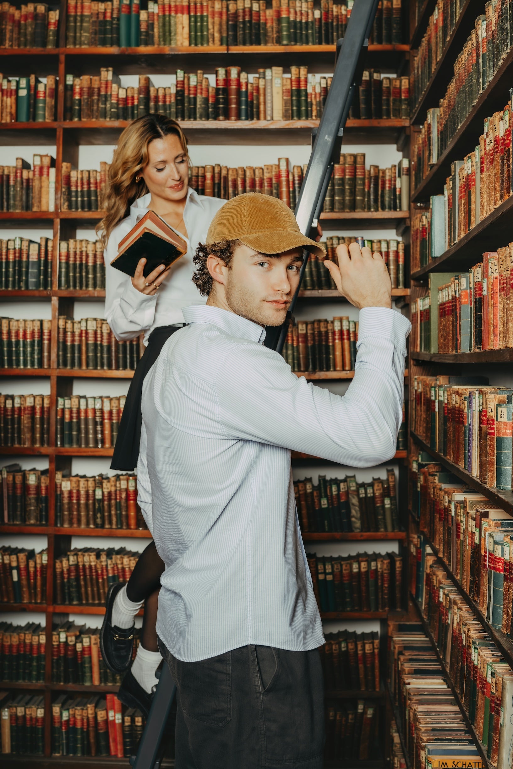 Corduroy cap styled with casual outfit in a library setting